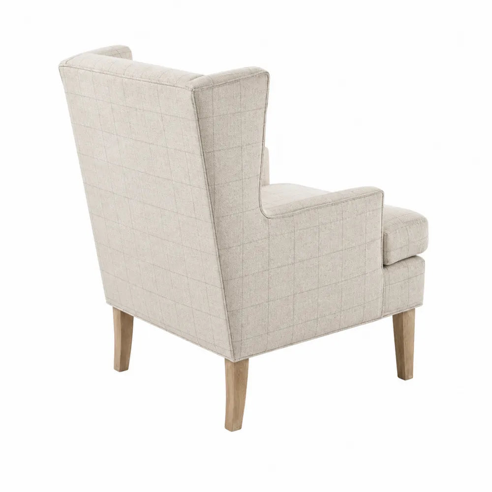 Poltrona in tessuto a quadri crema con gambe in legno